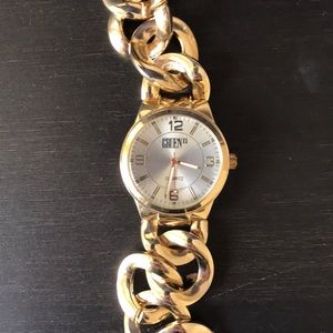 Gold band and blue face silver band men’s watch